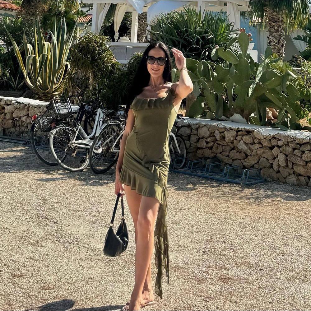 Green ruffle spaghetti strap dress with asymmetric tassel decor
